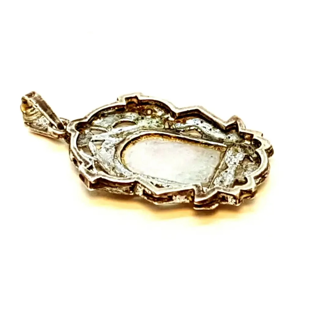 Old art deco religious medal. Mother-of-pearl cameo and silver medal.