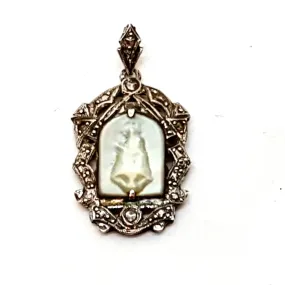 Old art deco religious medal. Mother-of-pearl cameo and silver medal.