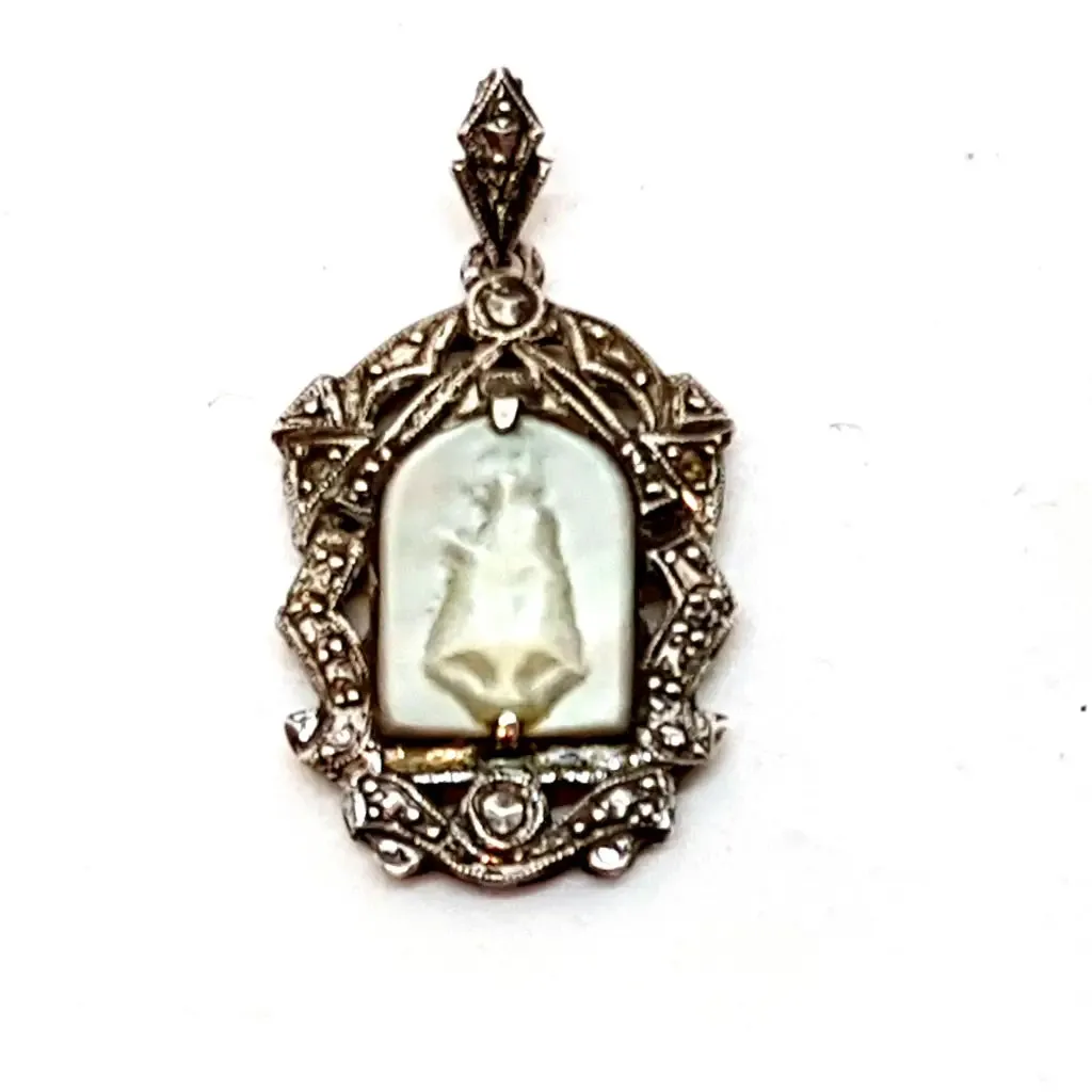 Old art deco religious medal. Mother-of-pearl cameo and silver medal.
