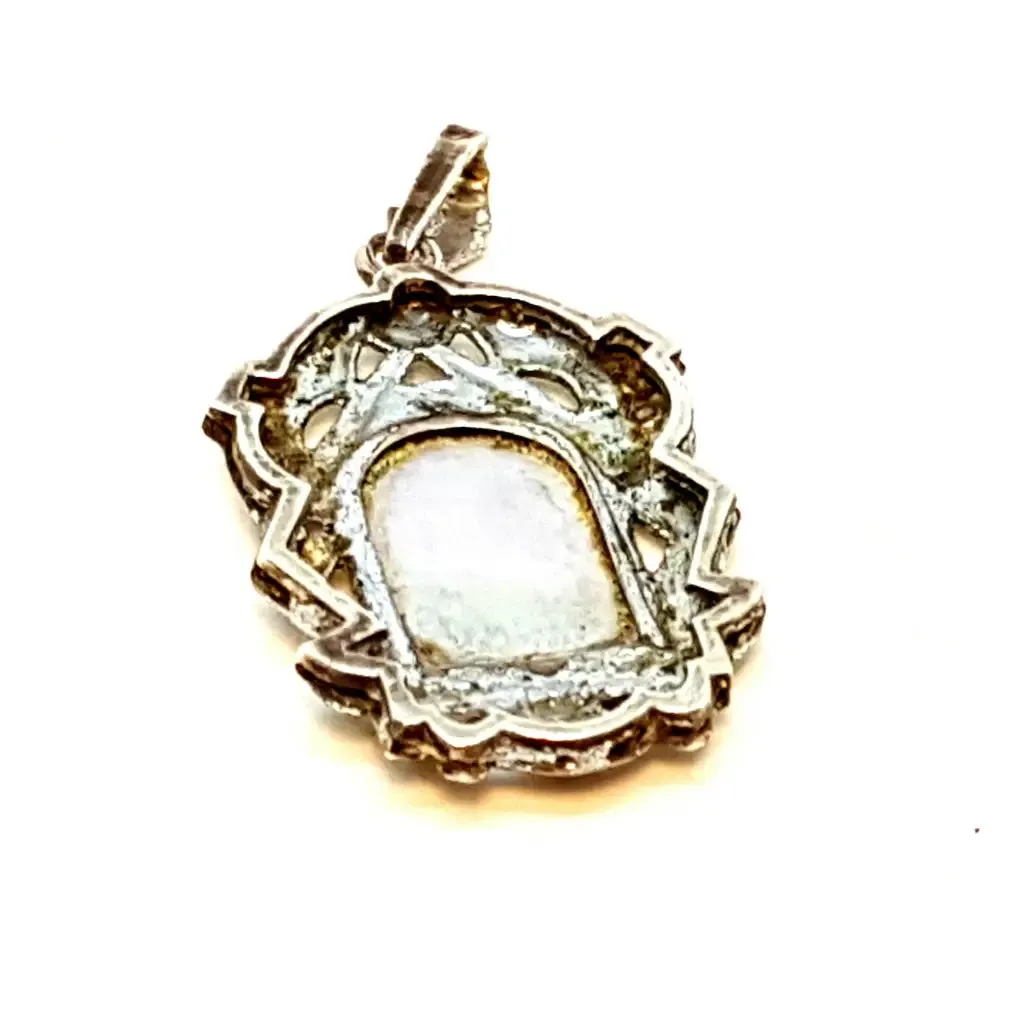 Old art deco religious medal. Mother-of-pearl cameo and silver medal.