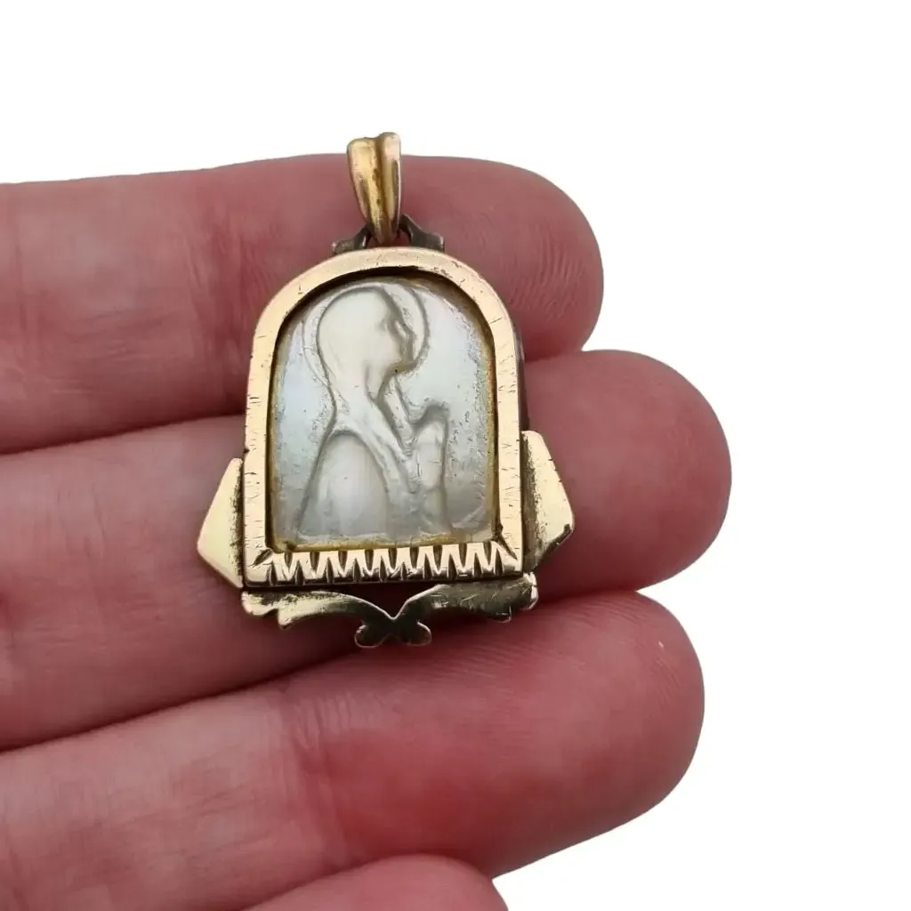 Old art deco religious medal. Mother-of-pearl cameo. Gilt silver medal.