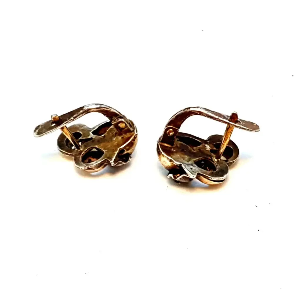 Silver and gold art deco earrings. Circa 1940. Antique and vintage jewelry.