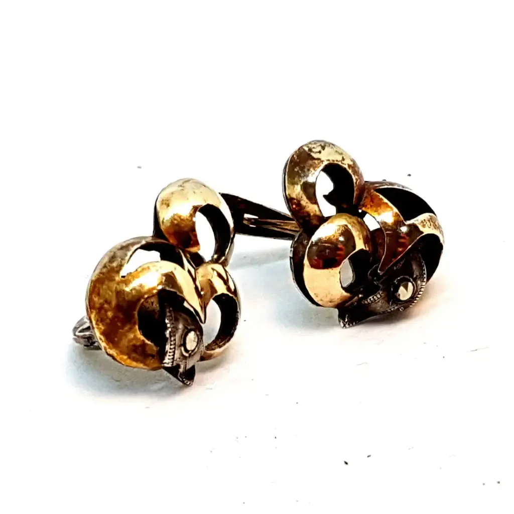 Silver and gold art deco earrings. Circa 1940. Antique and vintage jewelry.