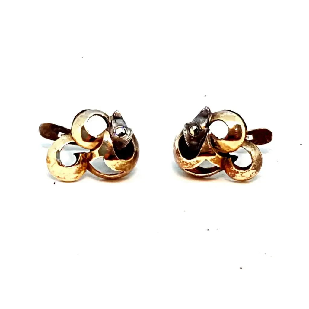 Silver and gold art deco earrings. Circa 1940. Antique and vintage jewelry.